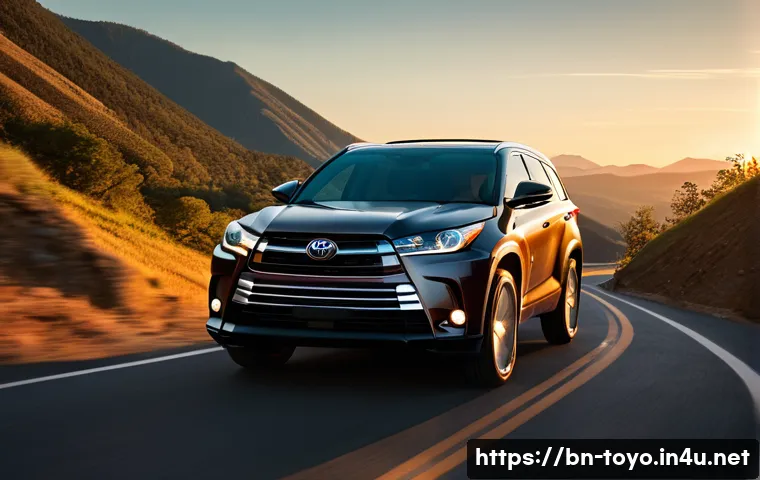 토요타 하이랜더의 장거리 주행 성능 - A sleek Toyota Highlander driving smoothly on a winding mountain road during sunset, showcasing its ...